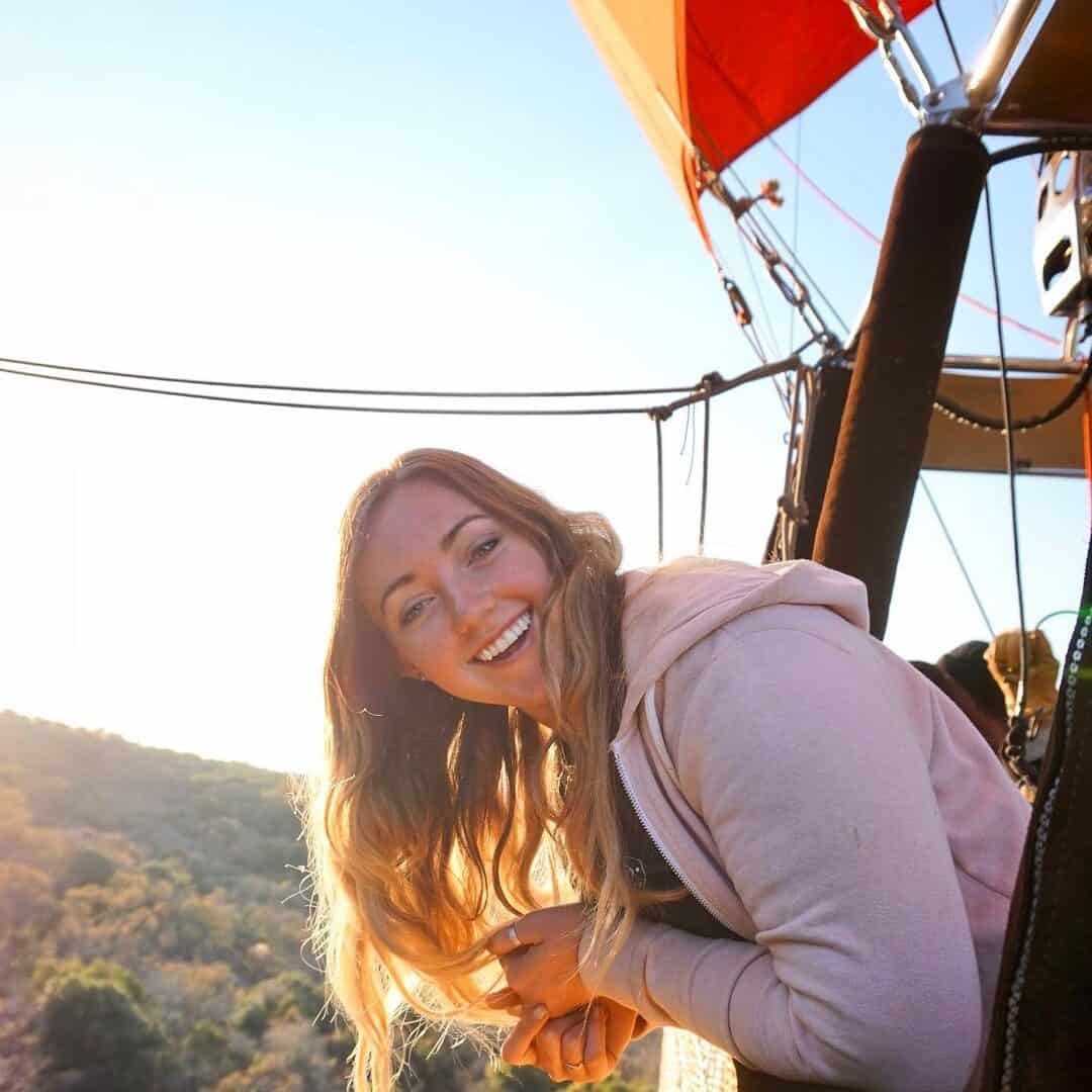 Jacqui smiling at camera while Riding a Hot Air Balloon in Johannesburg, South Africa.