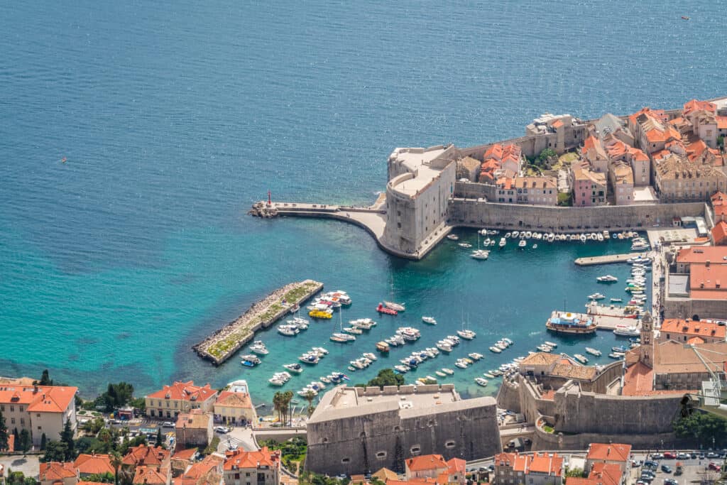 Aerial view of the Dubrovnik old town marina and Old Town walls, Croatia
